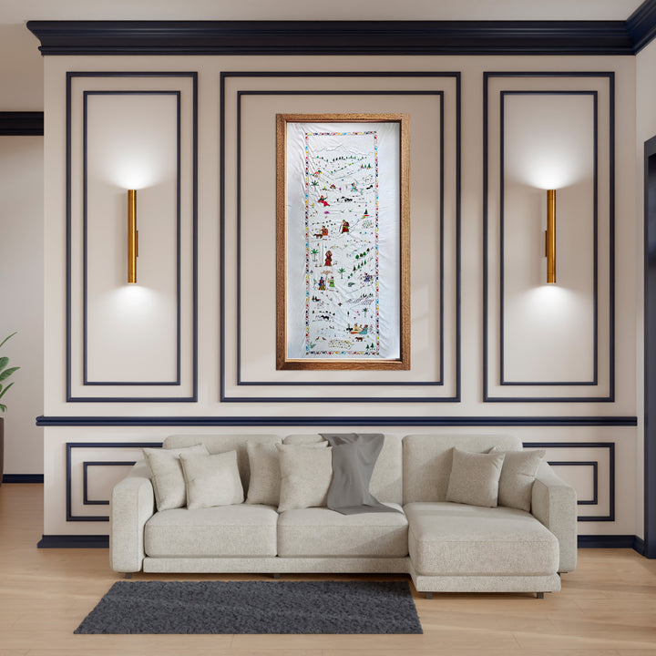 Beige sectional sofa in a room with decorative wall art and molding.
