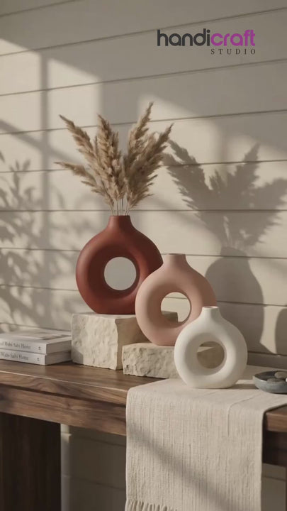 Ceramic donut vase with a fully hand glazed surface catching gentle daylight